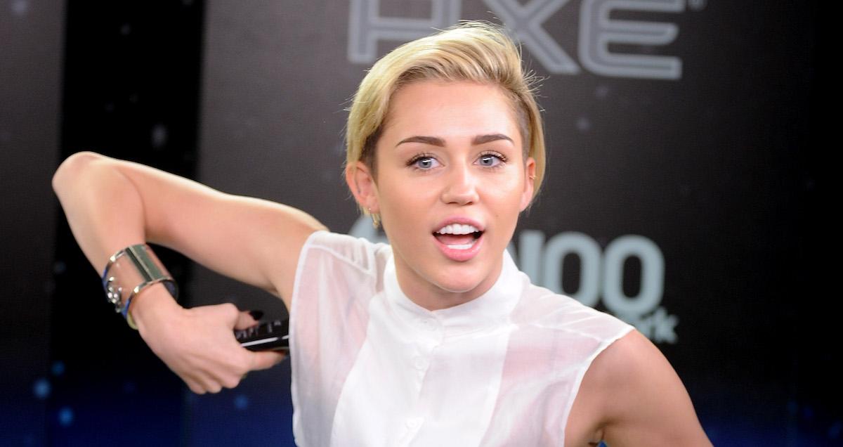 Miley Cyrus using deodorant