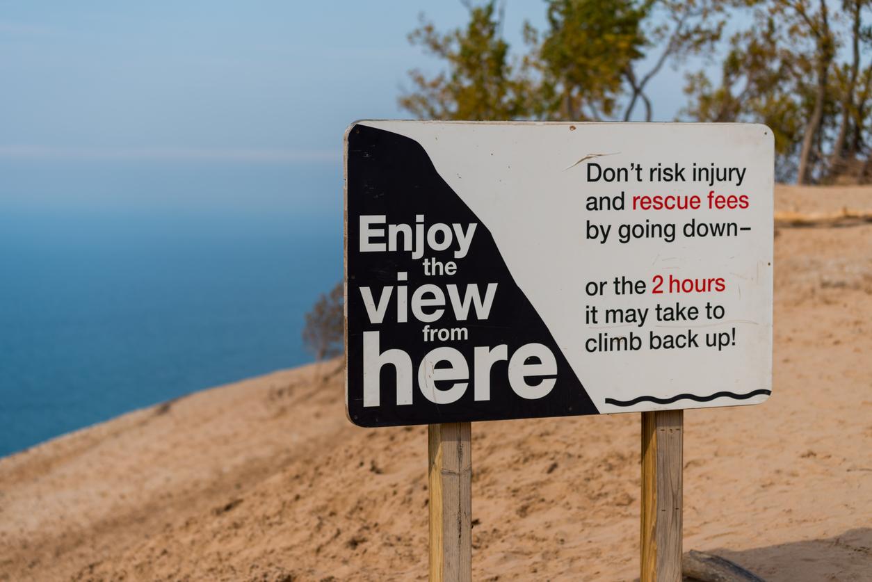 Along Lake Michigan's Sleeping Bear Sand Dunes asking visitors not to climb down the dunes to the risk of injury and rescue costs. 