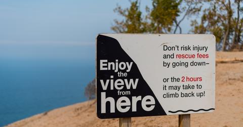 Along Lake Michigan's Sleeping Bear Sand Dunes asking visitors not to climb down the dunes to the risk of injury and rescue costs.