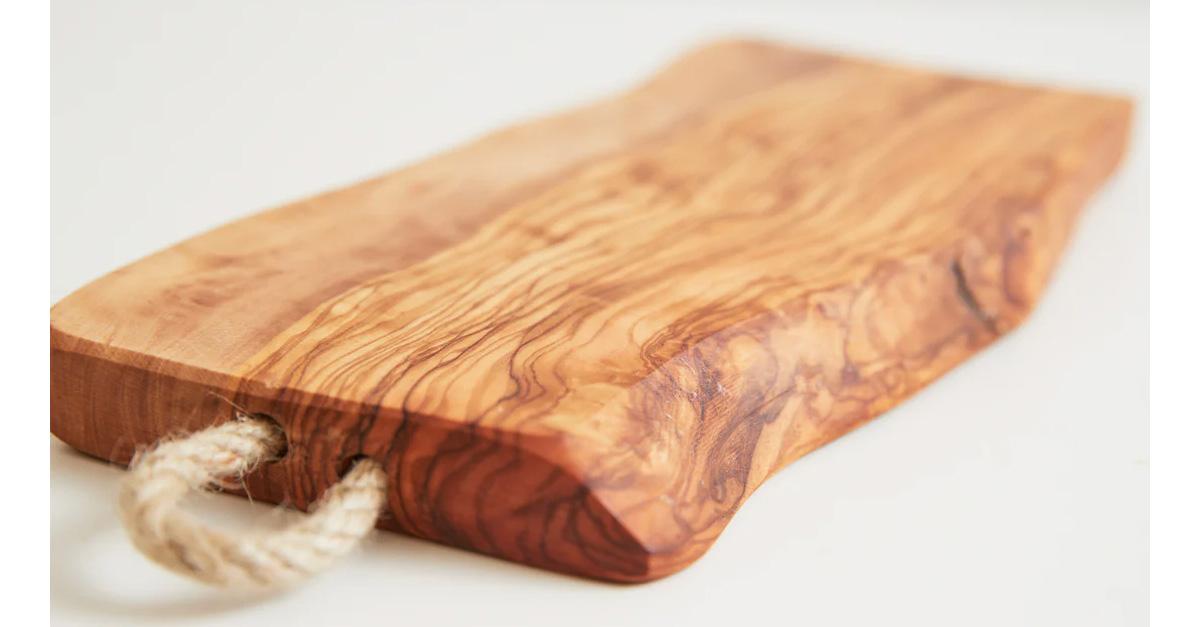 olive wood cutting board with rope for hanging.