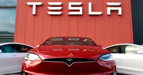 Tesla electric vehicles at a dealership.