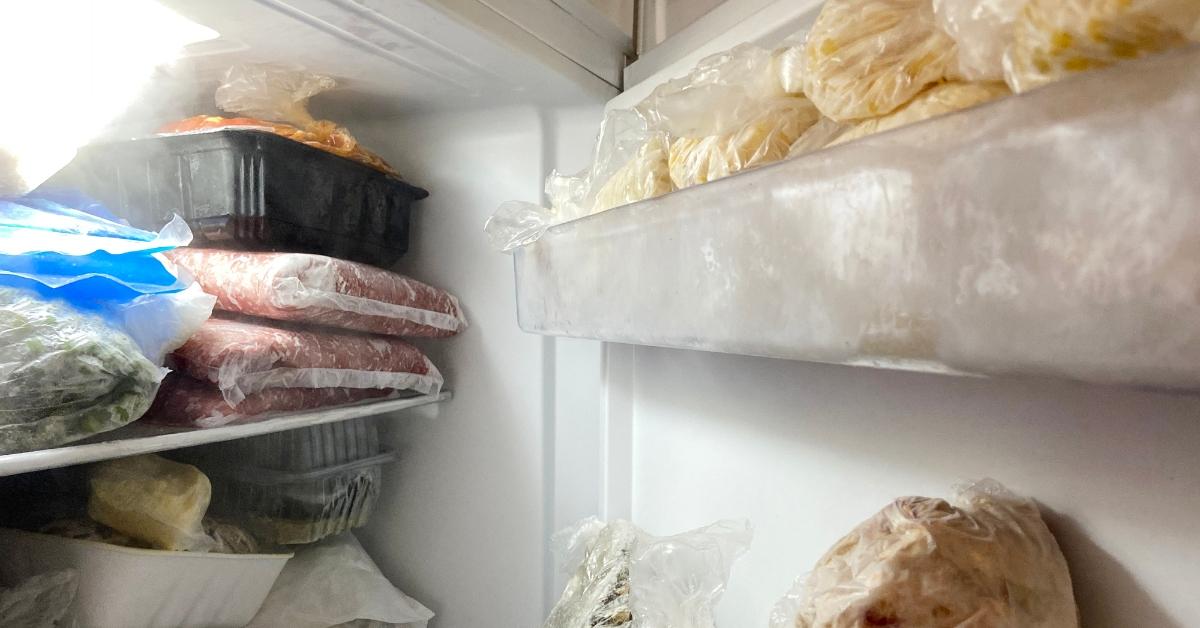 A freezer stocked with food. 