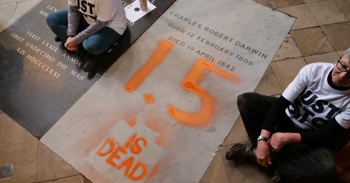 Activists spray painted 1.5 is dead on the grave of Charles Darwin