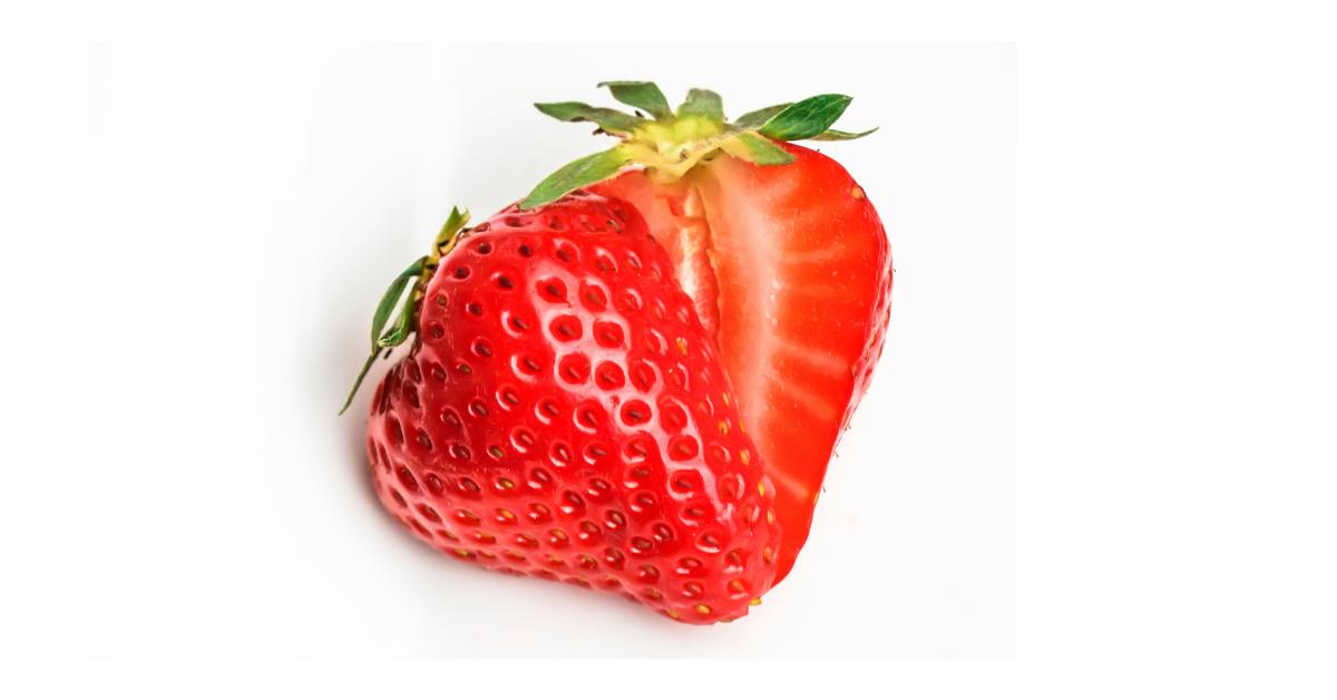 A closeup of a strawberry cut in half