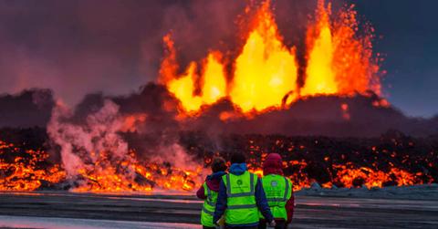 People watching a volcanic eruption. (Representative Cover Image Source: Getty Images | Arctic-Images)