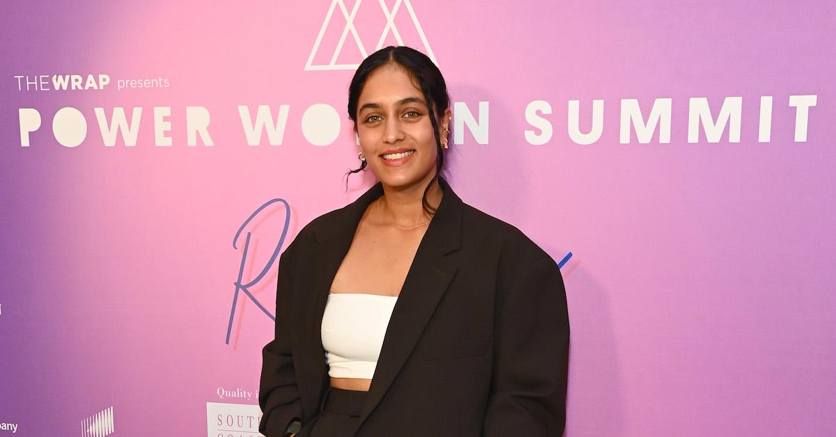 Radhi Devlukia-Shetty smiles in front of a pink background TheWrap Presents Power Women Summit at The Maybourne Beverly Hills on Dec. 5, 2023 in Beverly Hills, Calif.