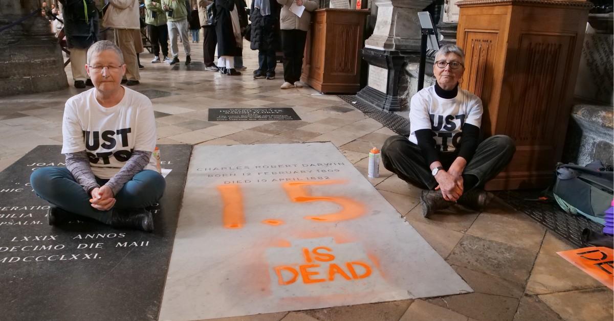 Alyson Lee and Di Bligh protested climate change by spray painting Darwin's grave