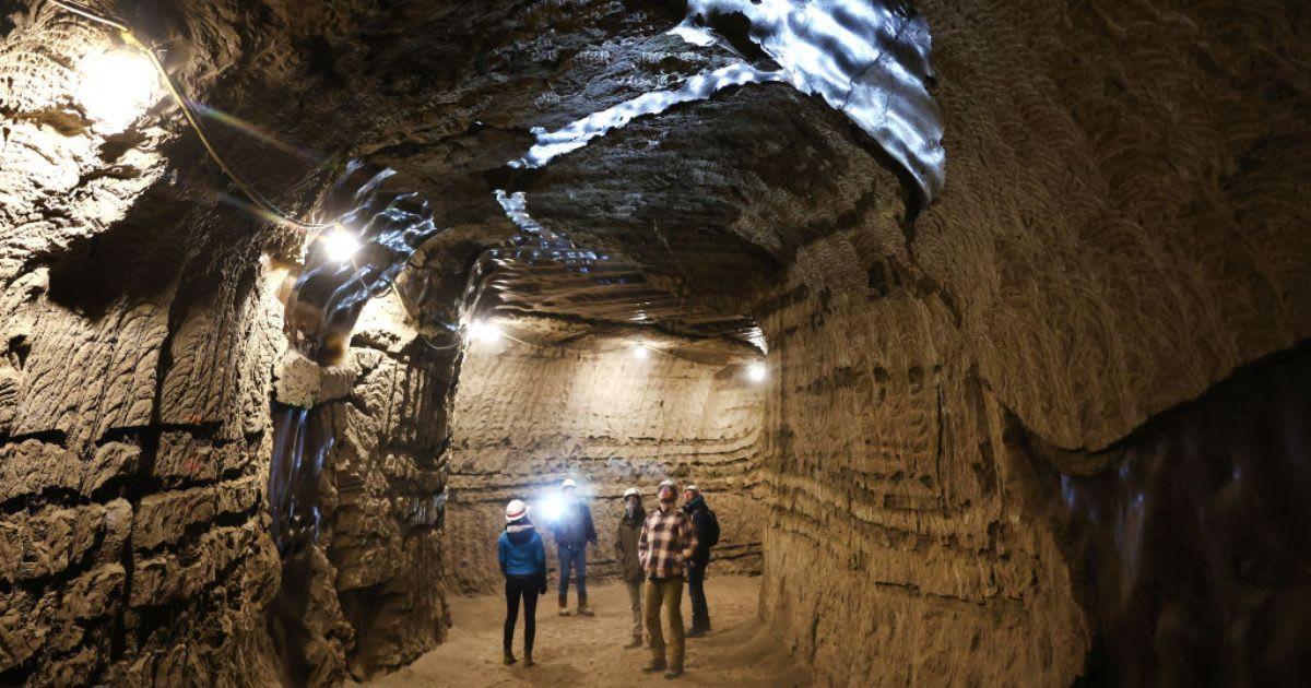 Researchers inside a permafrost tunnel. (Representative Cover Image Source: Getty Images | Mario Tama)