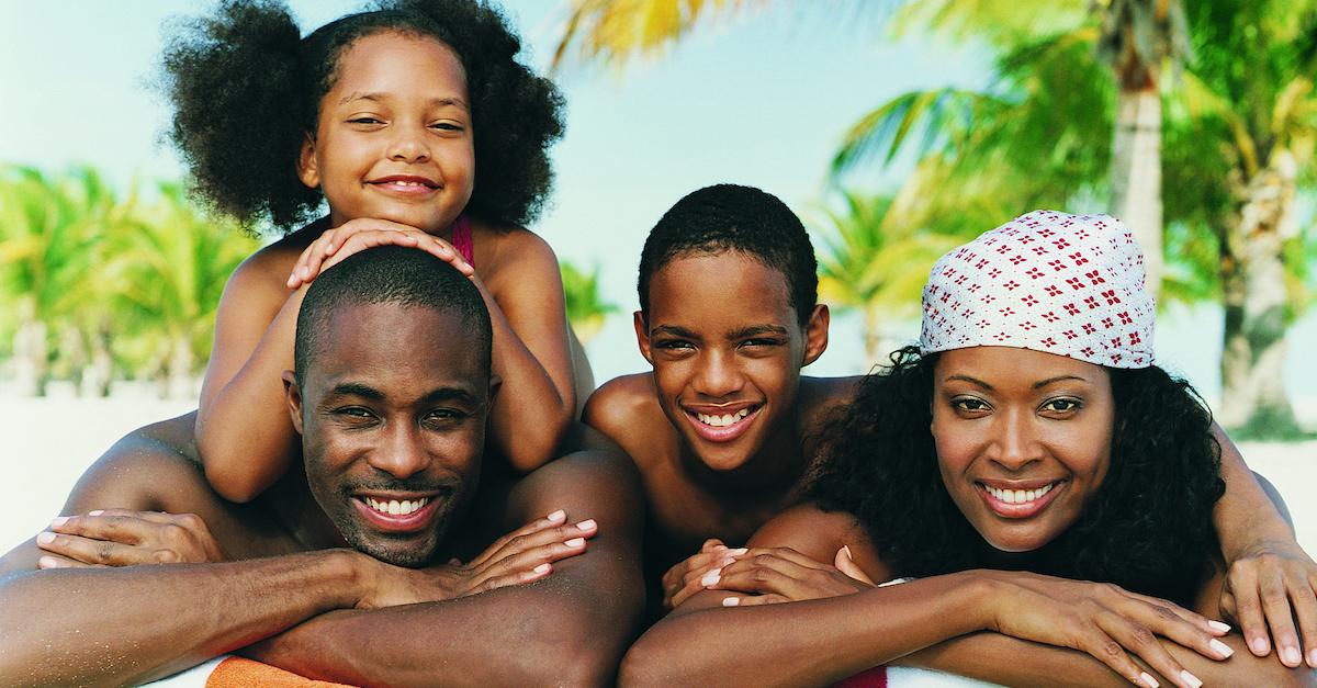 Smiling family at the beach.