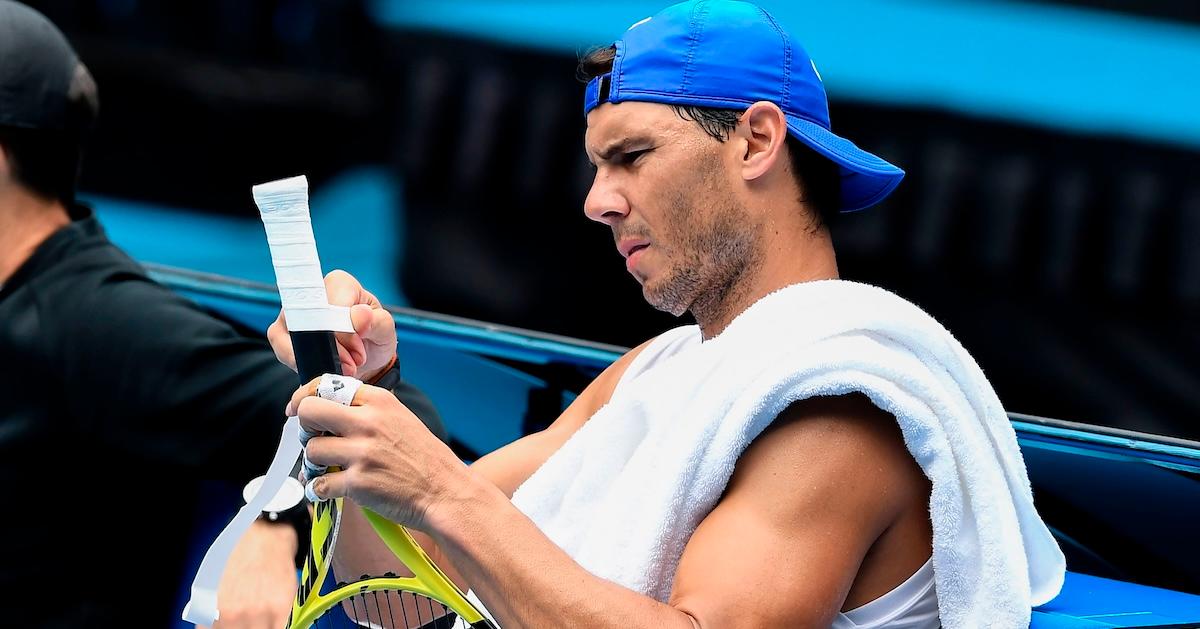 Rafael Nadal of Spain applies tape to the handle of his racquet during a practice session ahead of the Australia Open tennis tournament in Melbourne on Jan. 17, 2020.