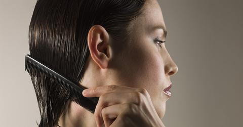 Woman combing hair