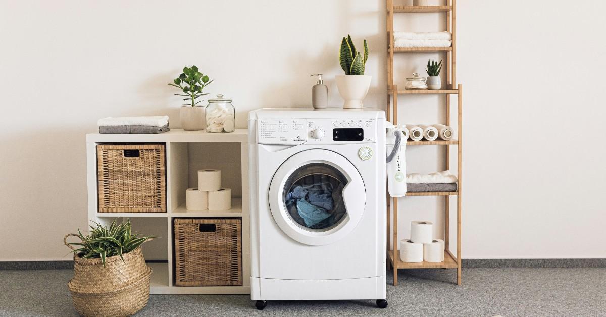 A set of shelves surrounds an aesthetically pleasing washing machine