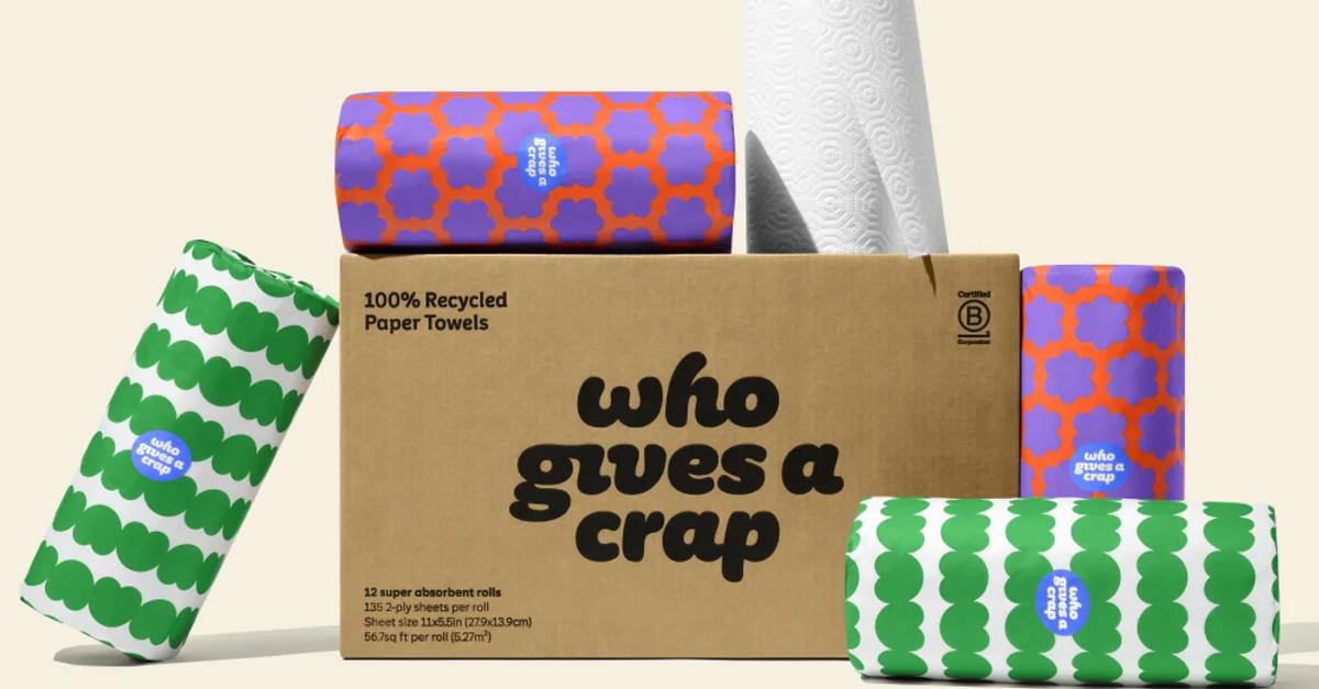 rolls of paper towels in graphic paper packaging and a cardboard box