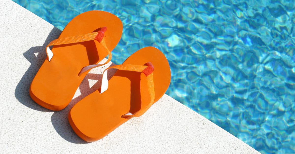 orange flip flops by the pool