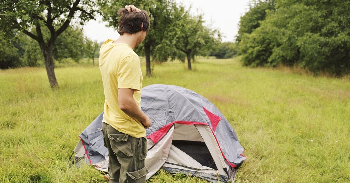 Man assembling a tent.