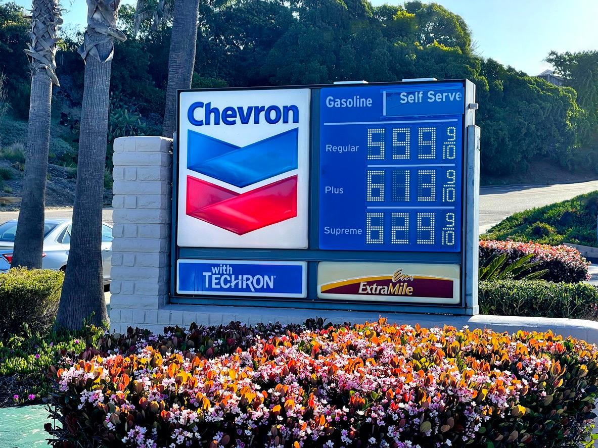 Sign at a Chevron gas station listing prices.