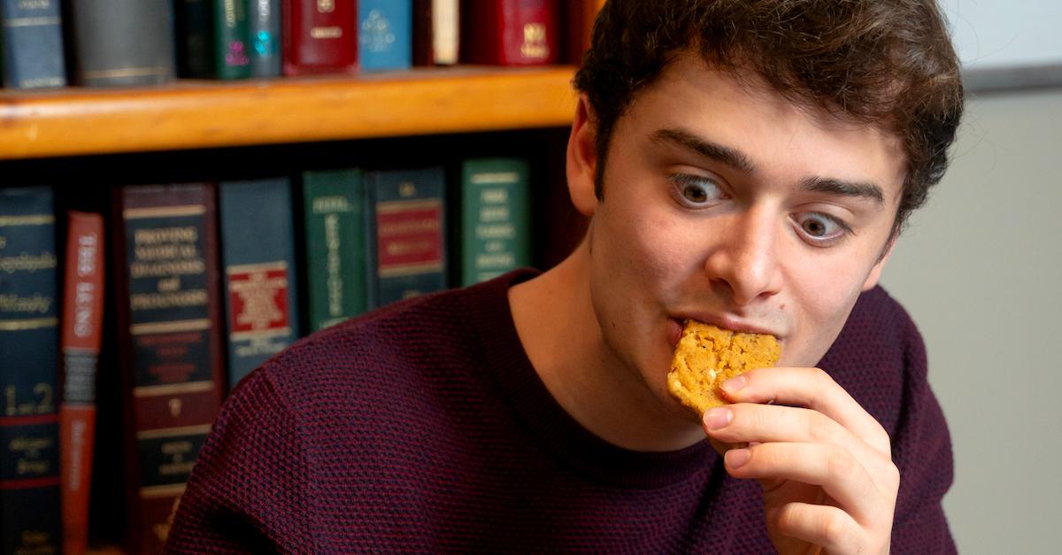 Noah Schnapp eating a MorningStar nugget.