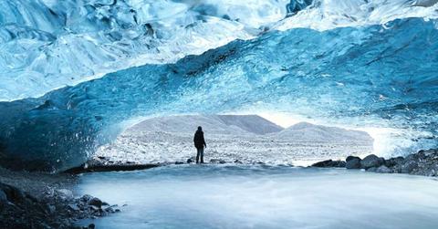 A diver exploring the bottom of a glacier. (Representative Cover Image Source: Photo by Valdemaras D/ Unsplash)
