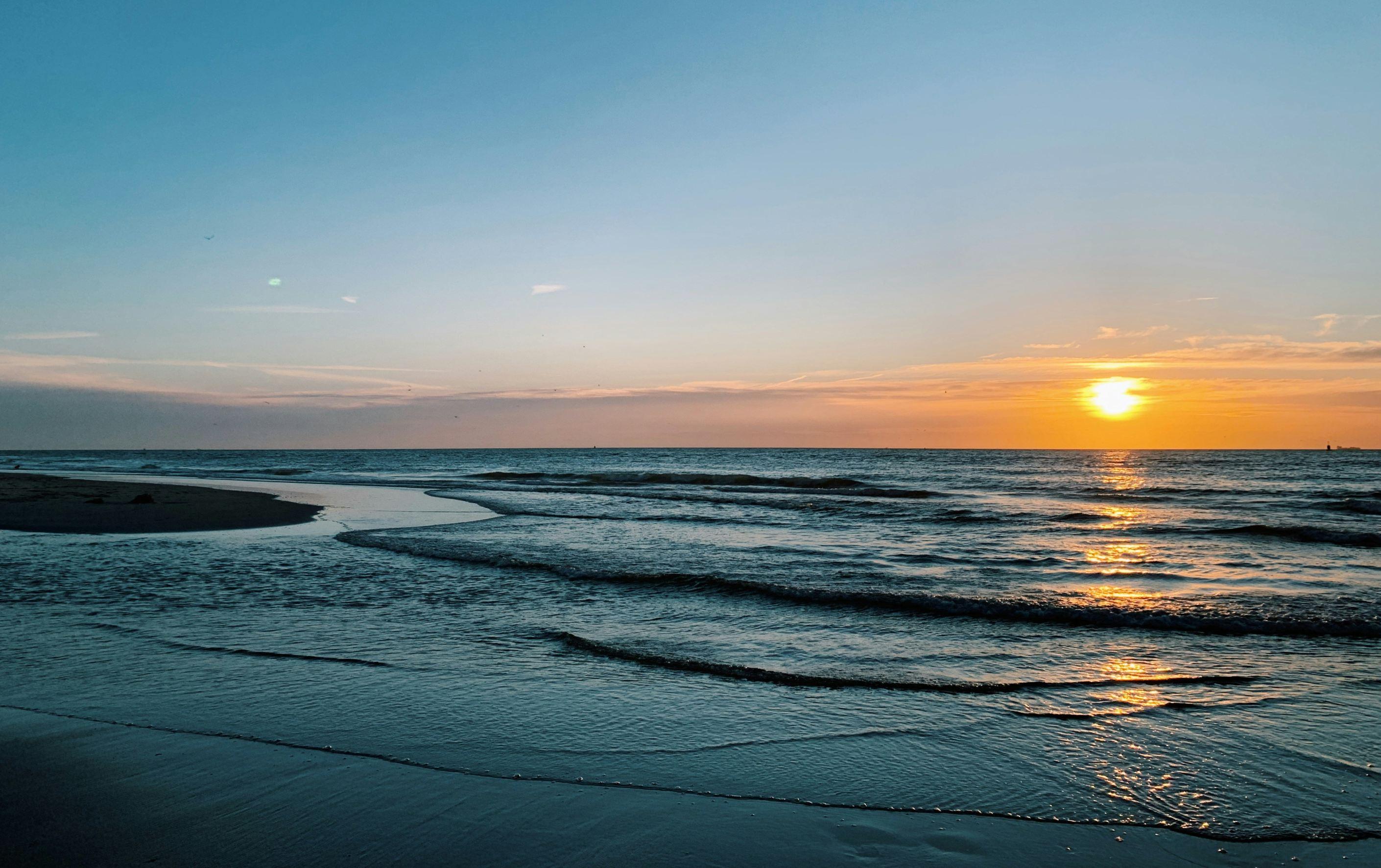 A view of the North Sea on the side of The Hague, Netherlands during sunset.