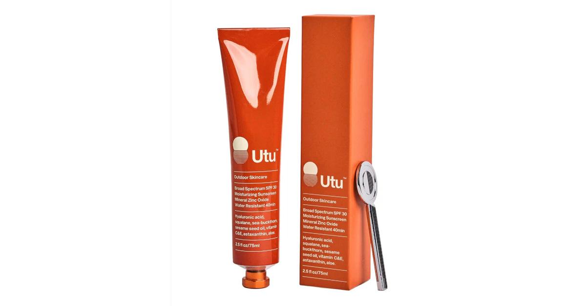 sunscreen in an orange tube beside an orange box