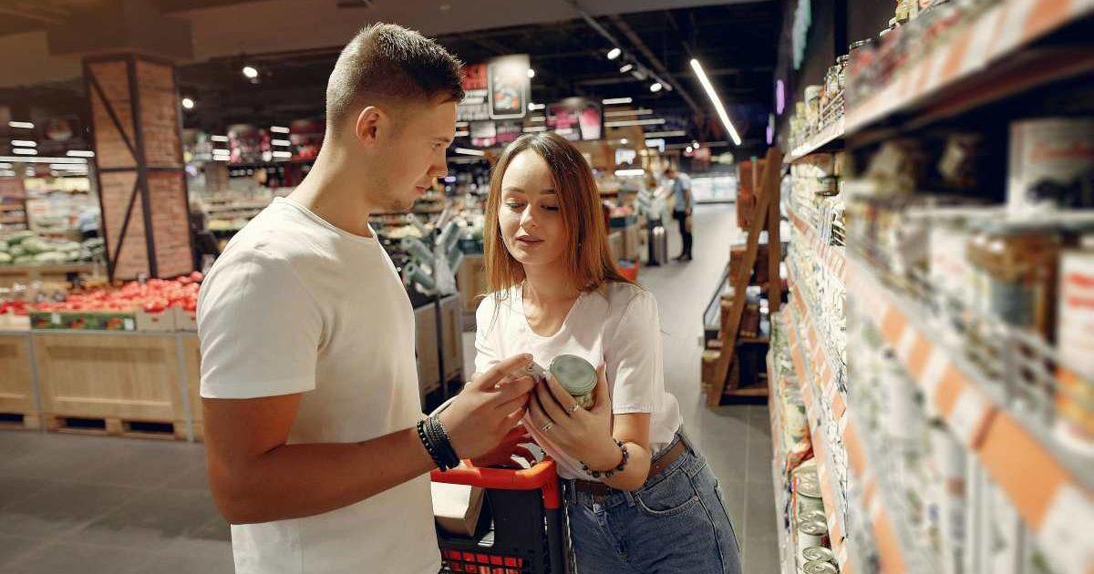 A couple buying canned food in the supermarket. (Representative Image Source: Pexels | Gustavo Fring)