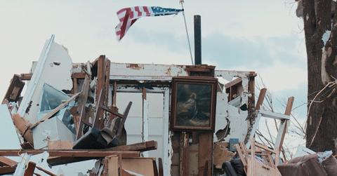 A flag and a religious photo are the only thing left standing after a tornado ripped through Joplin