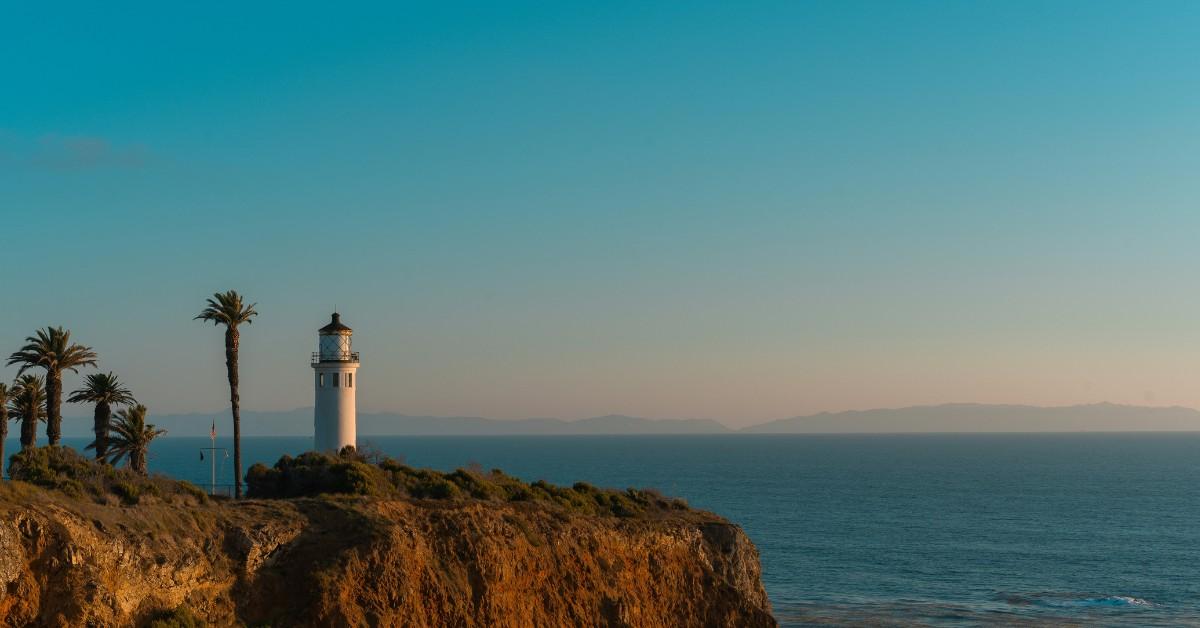 A lighthouse sits alone on a bluff overlooking the Pacific Ocean in Rancho Palos Verdes, California