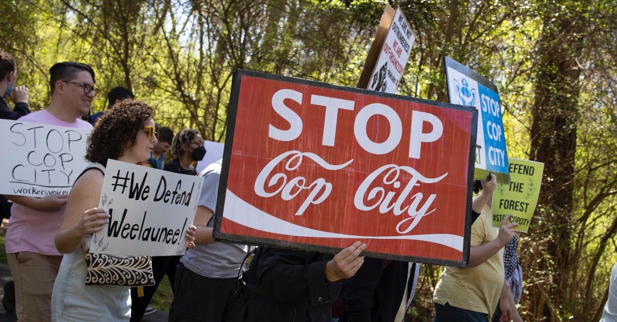 Activists carrying signs that say "Stop Cop City" in Atlanta, Georgia, 2023. 