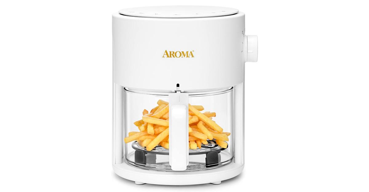 white air fryer with glass basket and French fries inside