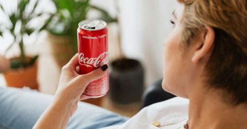 A person holding a can of Coca-cola while resting at home. (Representative Cover Image Source: Pexels | Kaboompics.com)