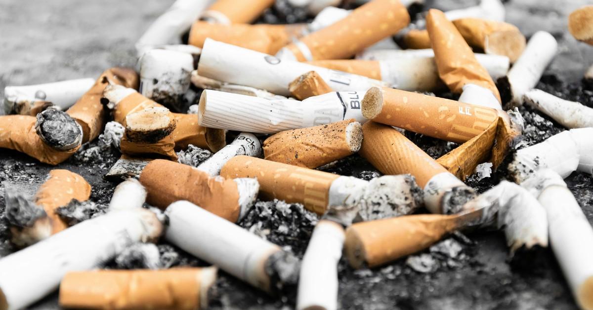 A closeup of a collection of cigarette butts
