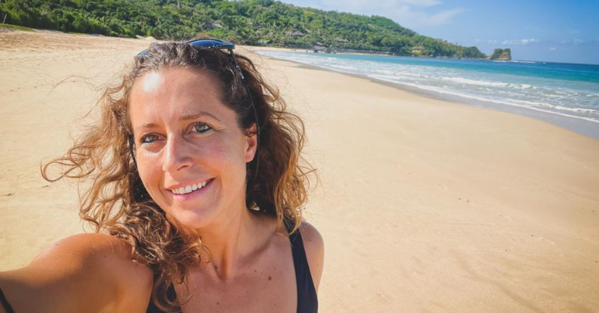 Giulia Manfrini snaps a selfie on the sandy shore of the beach