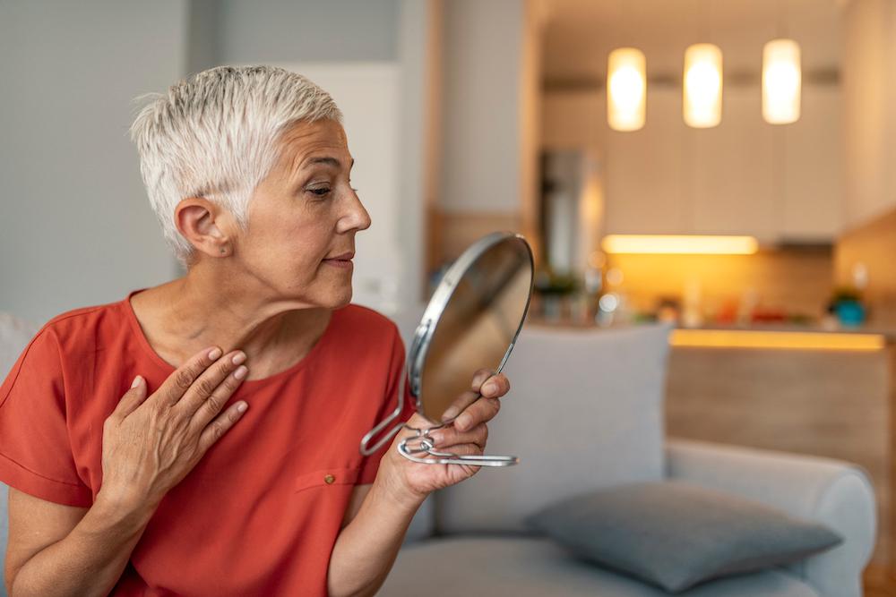 Woman looking in a mirror.