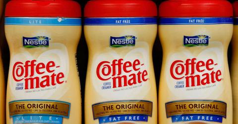 Three bottles of Coffee mate coffee creamer: one lite and two original