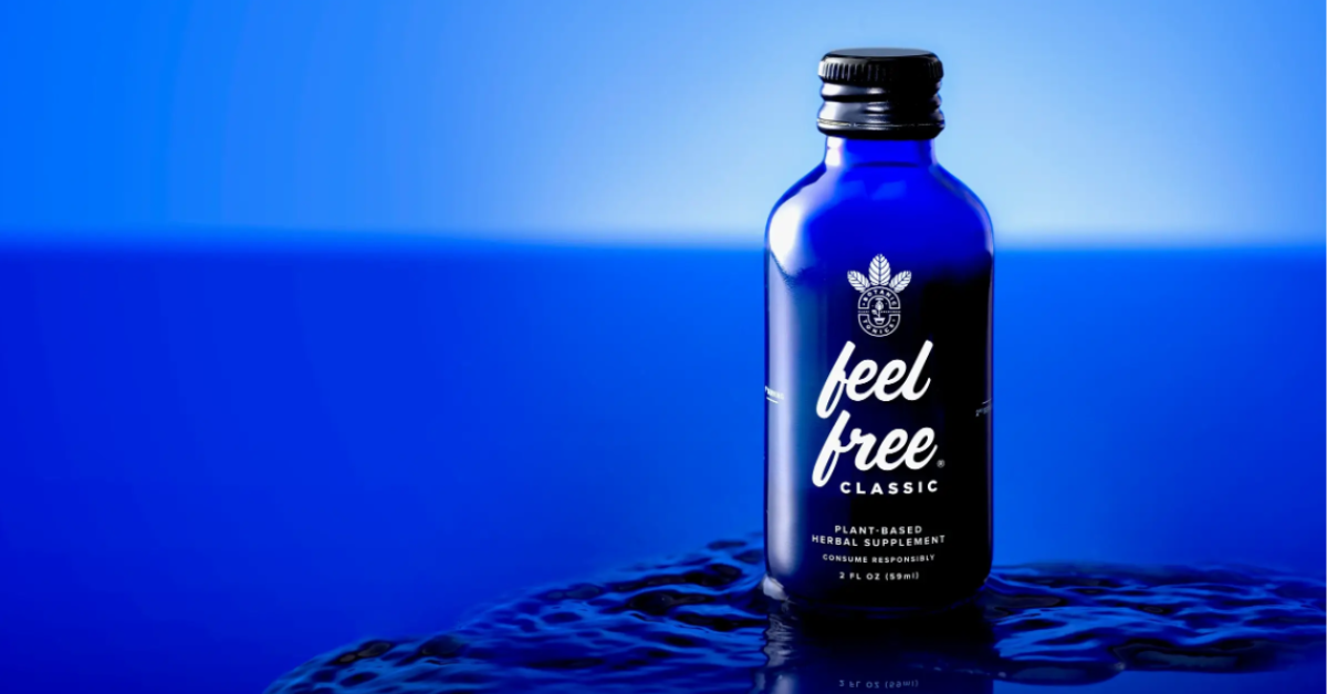A blue bottle of Feel Free sits on a blue background