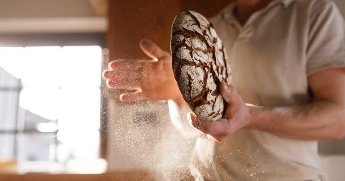 A person dusting off the flour from a bread (Representative Cover Image Source: Pixabay | Intuitivmedia)
