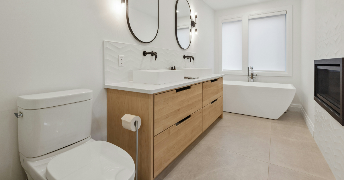 A toilet sits next to a sink in a bathroom