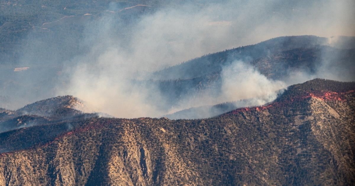 Arial photograph of wildfires in the mountains.