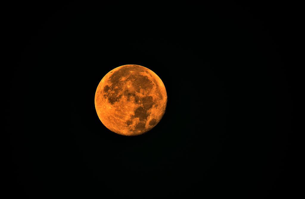 Here's Why Tonight's Moon Appears Orange, Explained