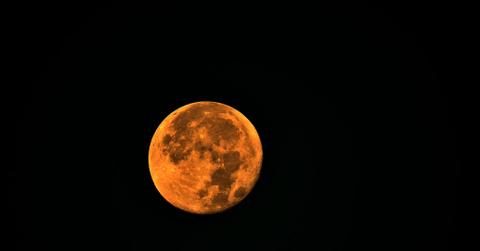 A view of the rare, orange-appearing Blue Supermoon in Marseille, France.