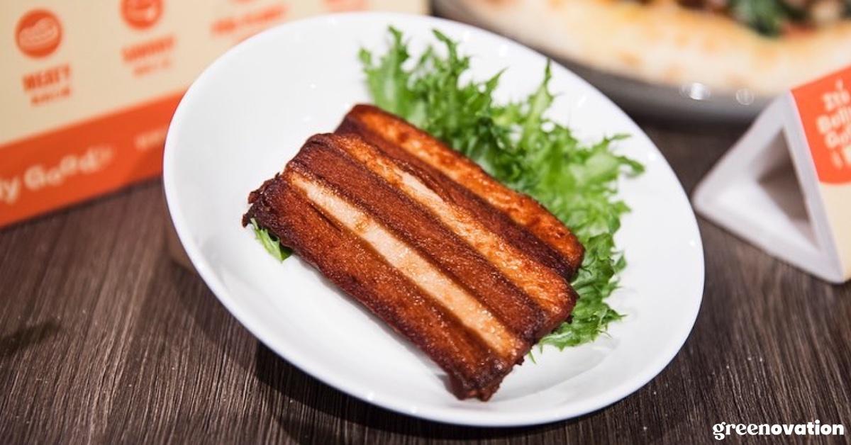 A slice of Lypid's vegan pork belly and greens on a dish