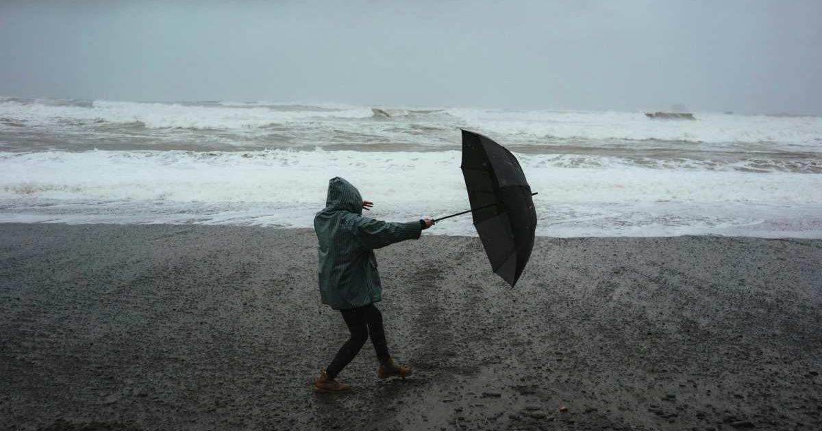 A man struggles with strong gusts of wind during a storm (Representative Cover Image Source: Pexels | Dziana Hasanbekava)