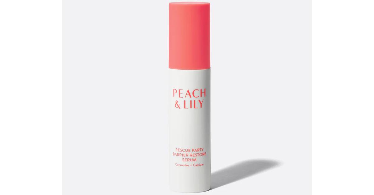 Korean skincare serum in a white and peach bottle