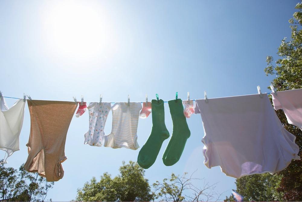 Various clothes drying on a clothing line. 