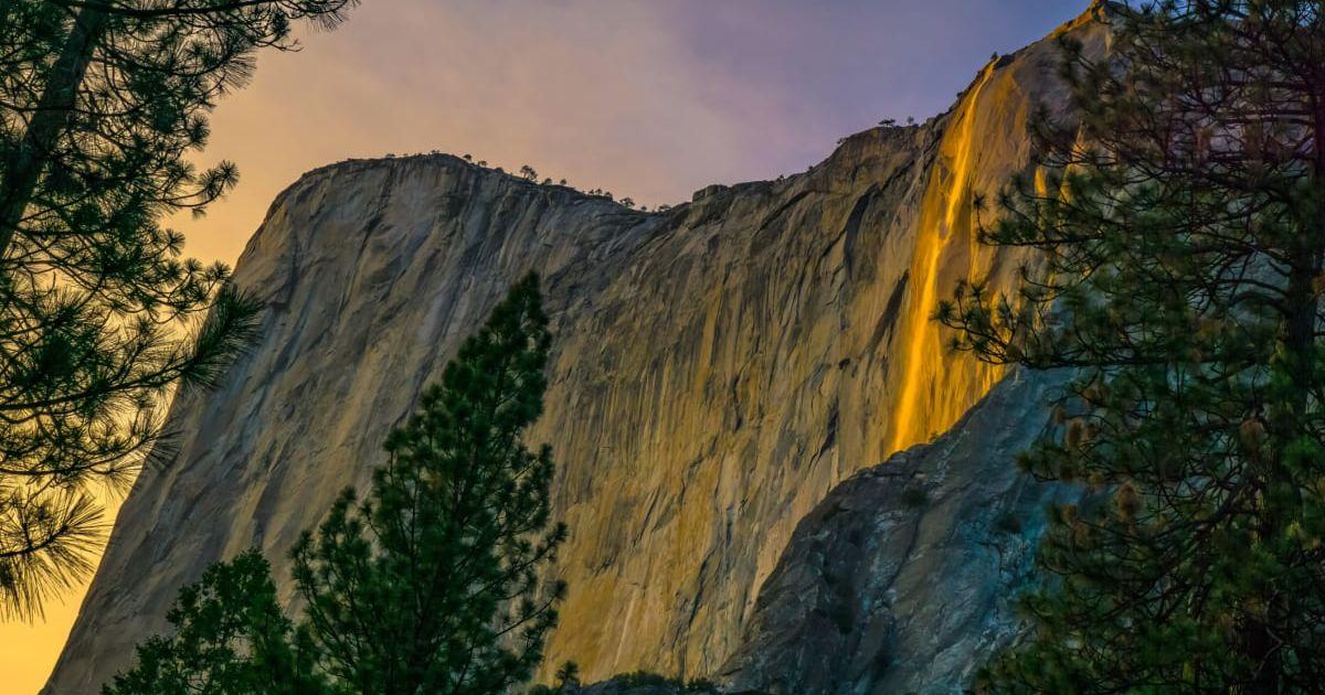A 'Firefall' moment at the Horsetail Waterfall in Yosemite National Park in California. Each February, when conditions are perfect, Horsetail Fall glows orange and red at sunset (Cover Image Source: Getty Images | Michael Castaneda
