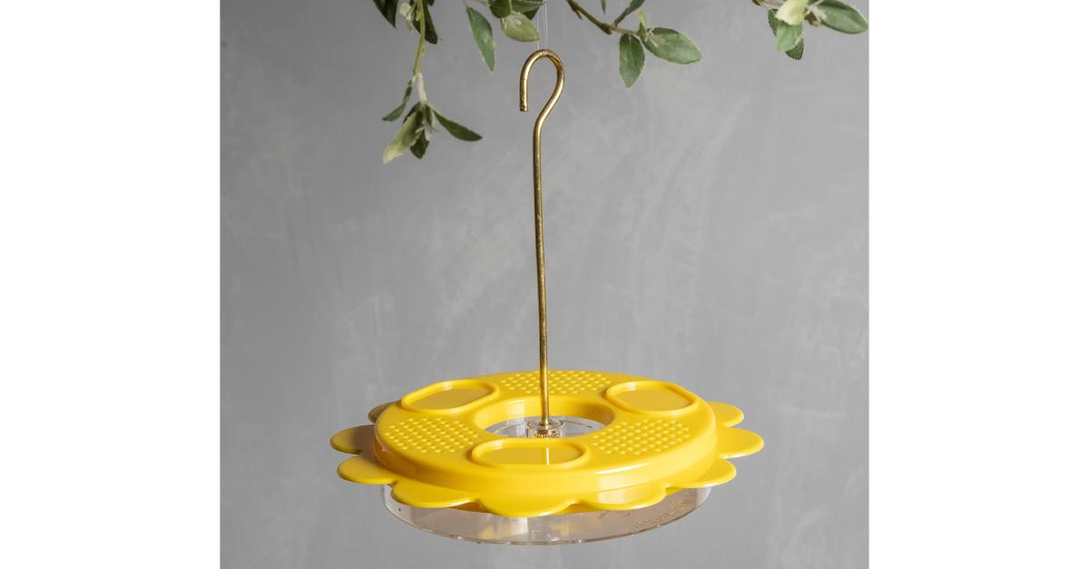 Yellow, flower-shaped hanging butterfly feeder