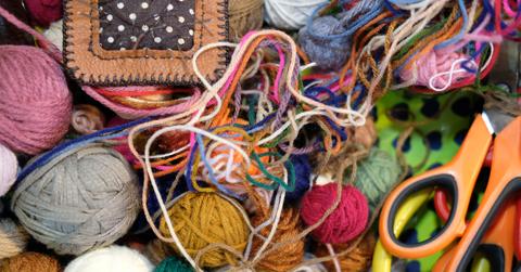 A close up of various yarn scraps of all colors and fibers.