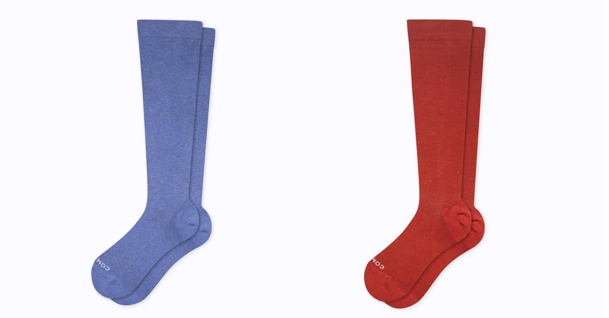 Three pairs of compression socks in blue, red