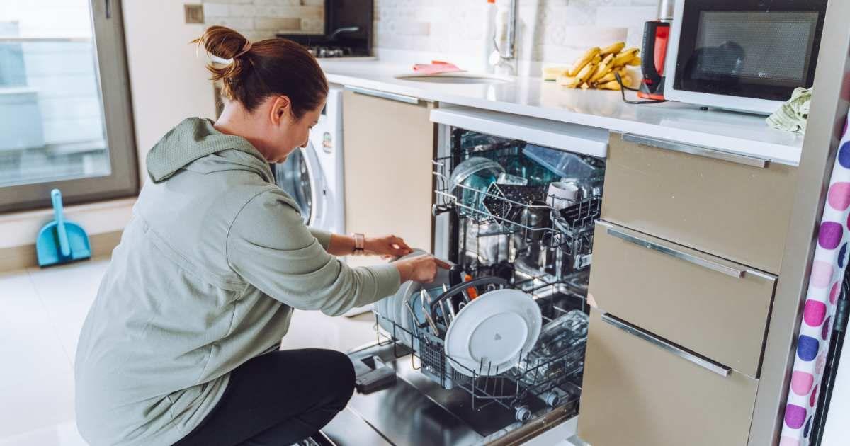 A woman is loading the dishes into the dishwasher. (Representative Cover Image Source: Getty Images | Olga Rolenko)