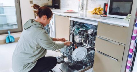 A woman is loading the dishes into the dishwasher. (Representative Cover Image Source: Getty Images | Olga Rolenko)